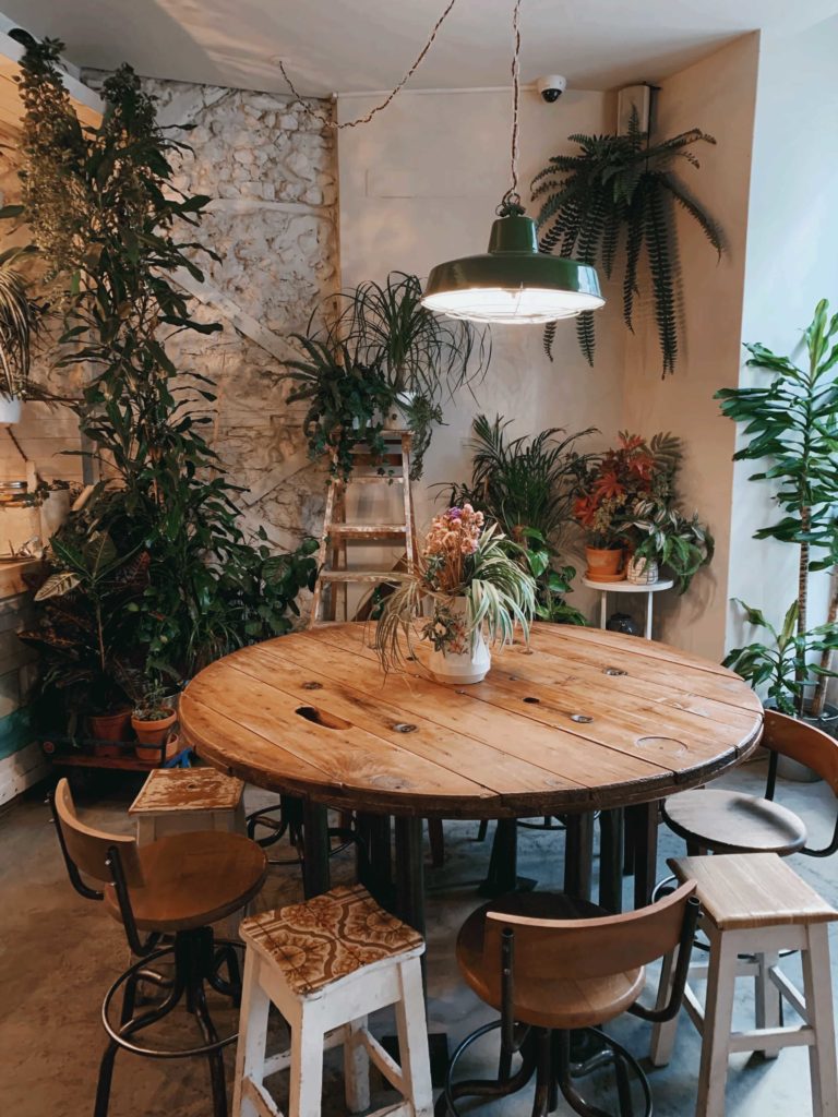 Wooden table in Instagrammable Flora and Fauna in Lisbon