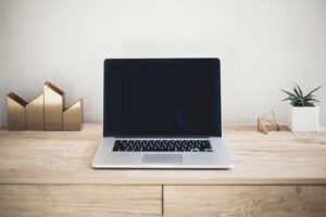 Image of a laptop on a wooden desk